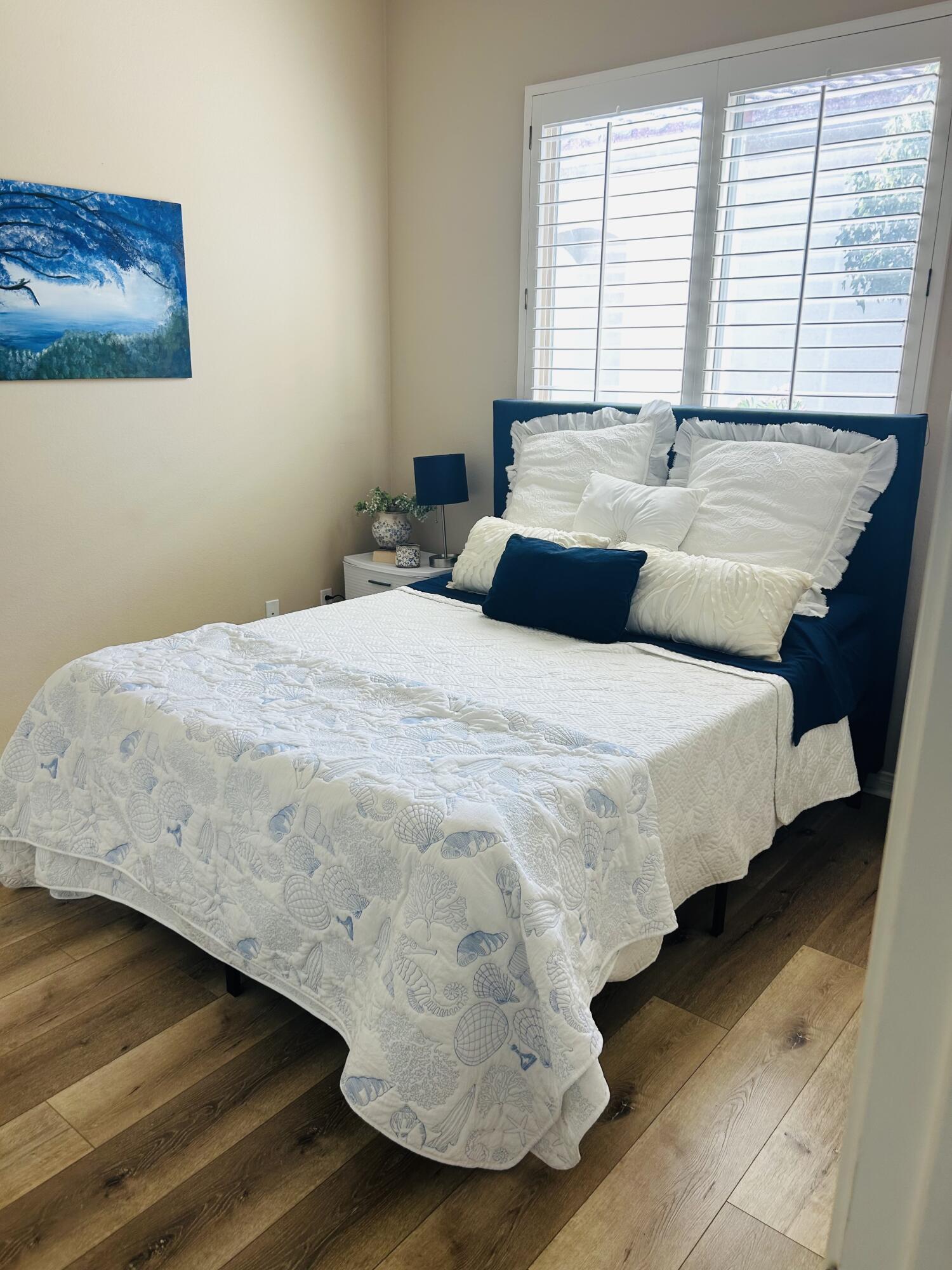 81602 Avenida Alturas Indio, CA 92203 - Photo 16 of 31 a bedroom with a bed and window