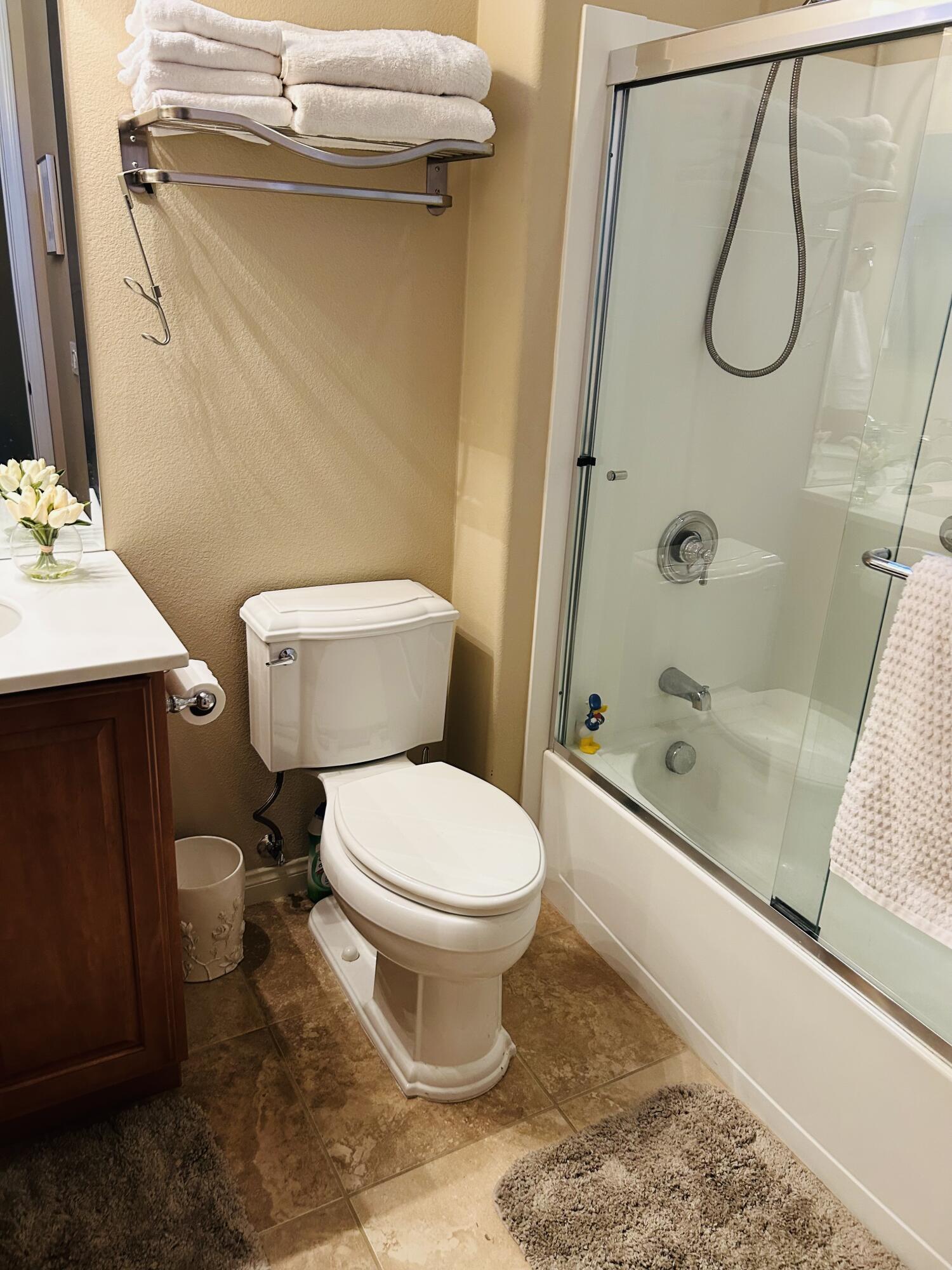 81602 Avenida Alturas Indio, CA 92203 - Photo 17 of 31 a bathroom with a toilet sink and shower