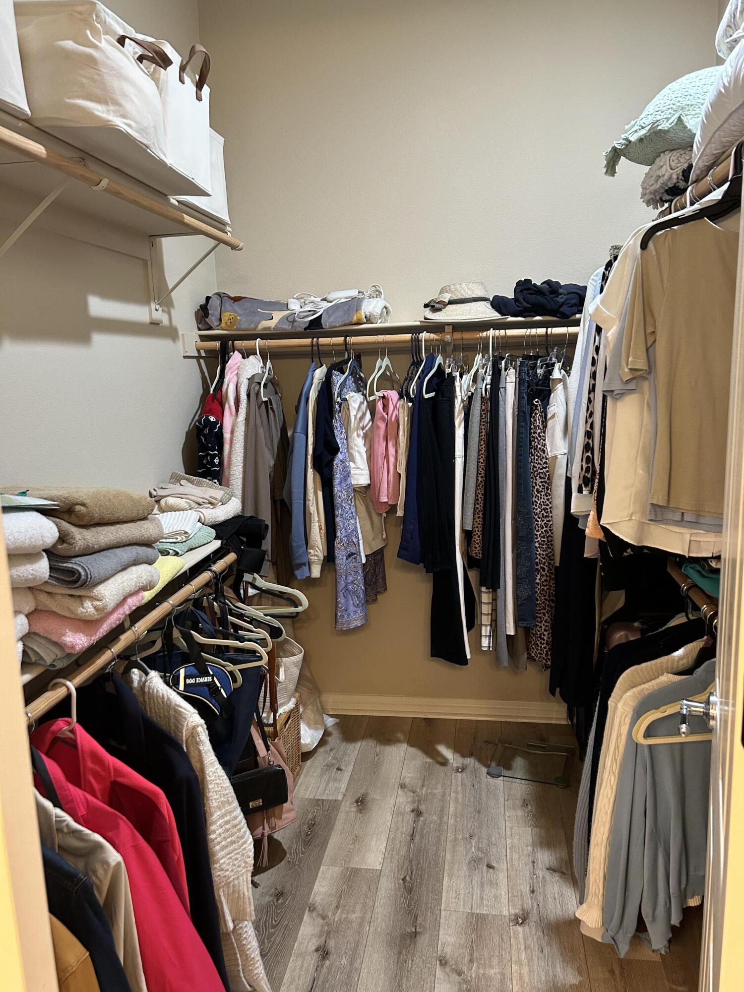 81602 Avenida Alturas Indio, CA 92203 - Photo 22 of 31 a view of walk in closet with clothes and shoes