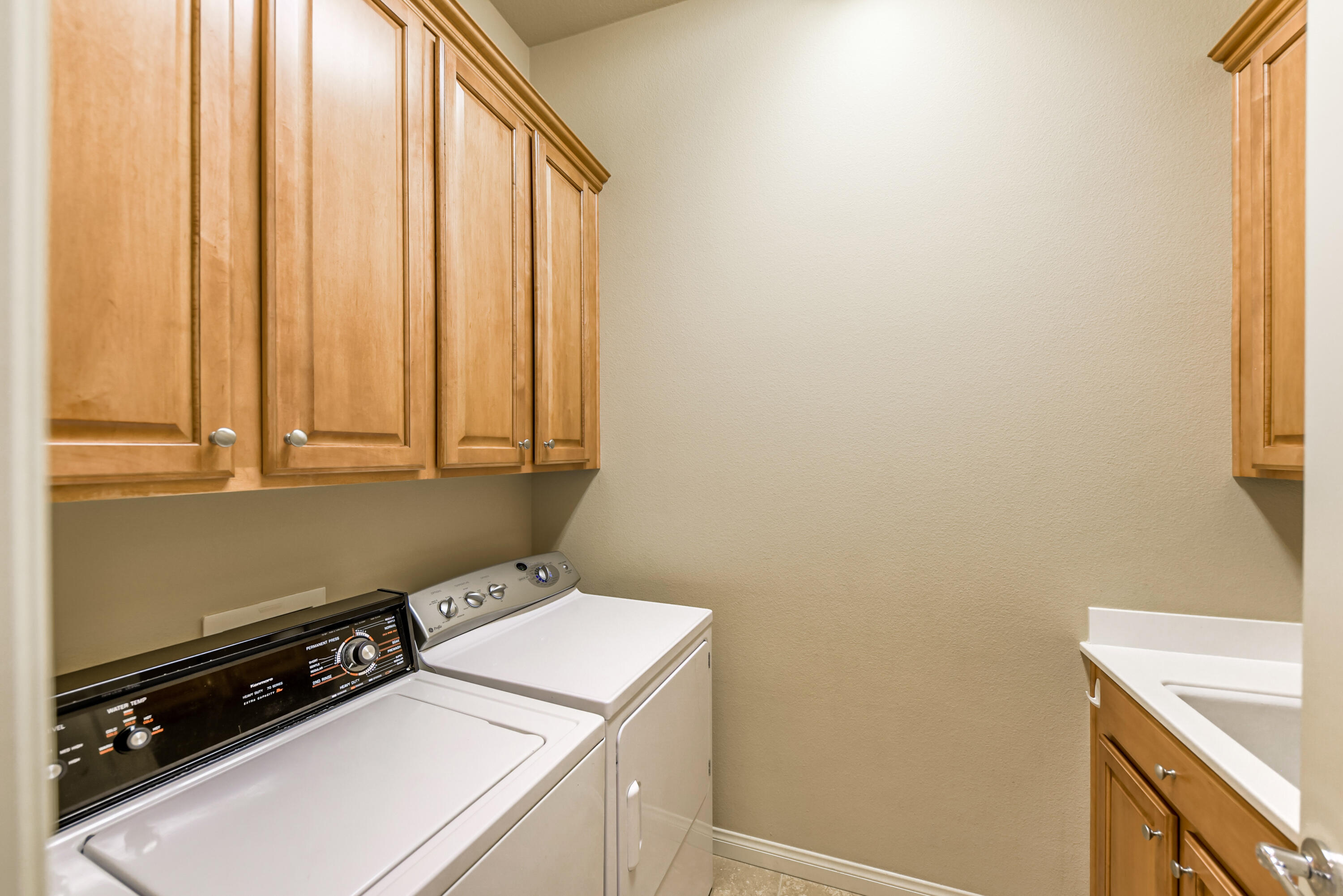 81602 Avenida Alturas Indio, CA 92203 - Photo 23 of 31 a utility room with dryer and washer