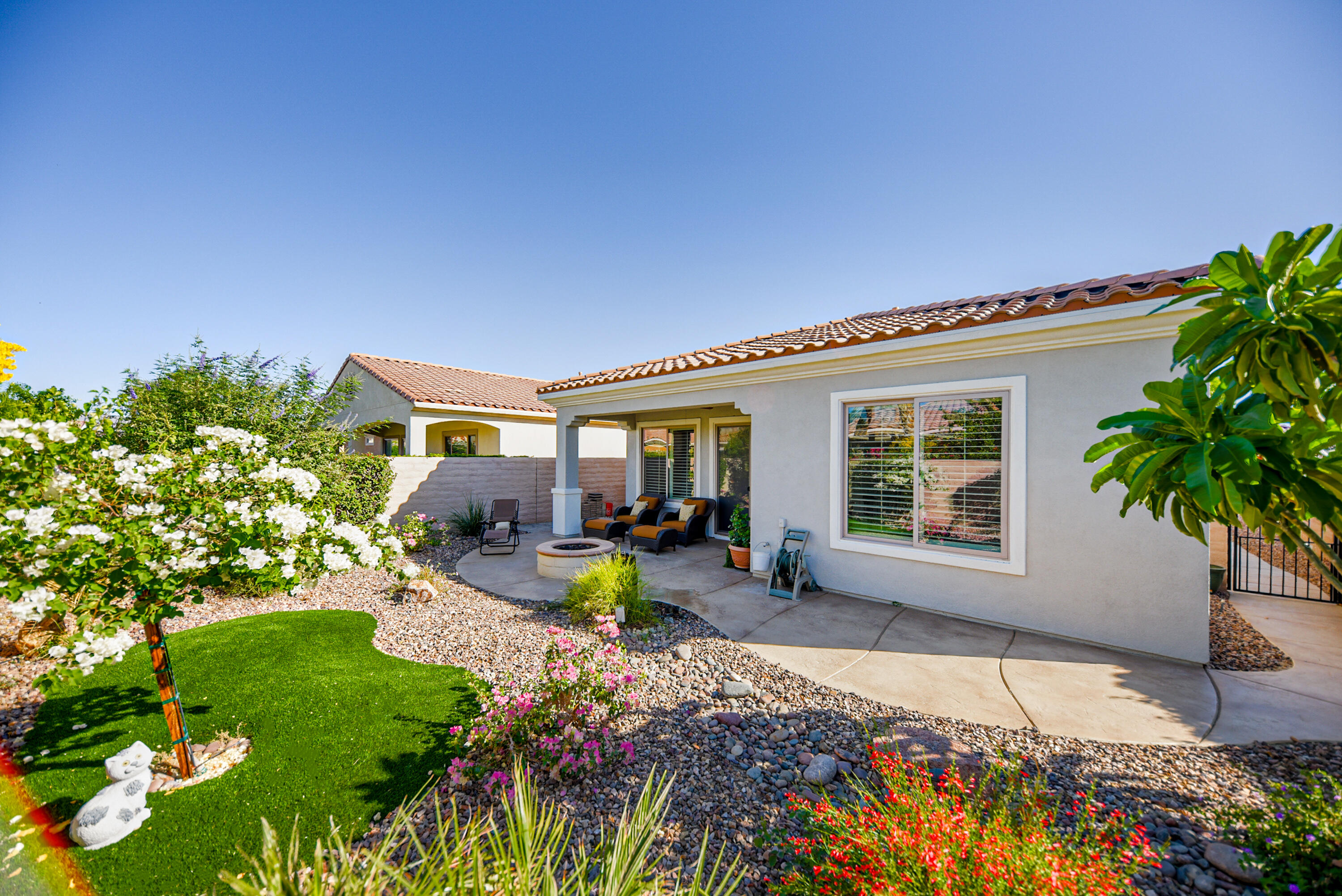81602 Avenida Alturas Indio, CA 92203 - Photo 4 of 31 a view of a house with backyard sitting area and garden