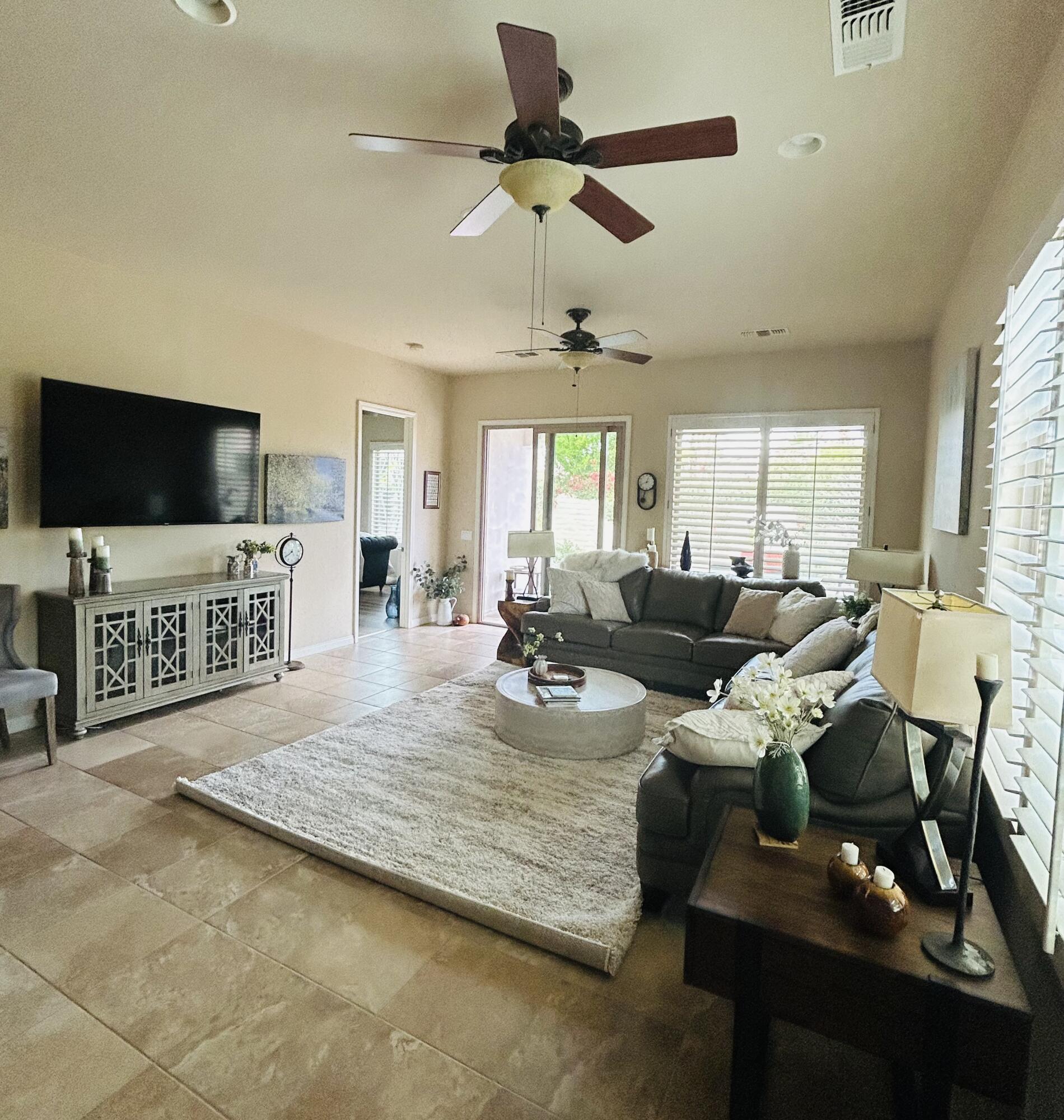 81602 Avenida Alturas Indio, CA 92203 - Photo 10 of 31 a living room with furniture and a flat screen tv