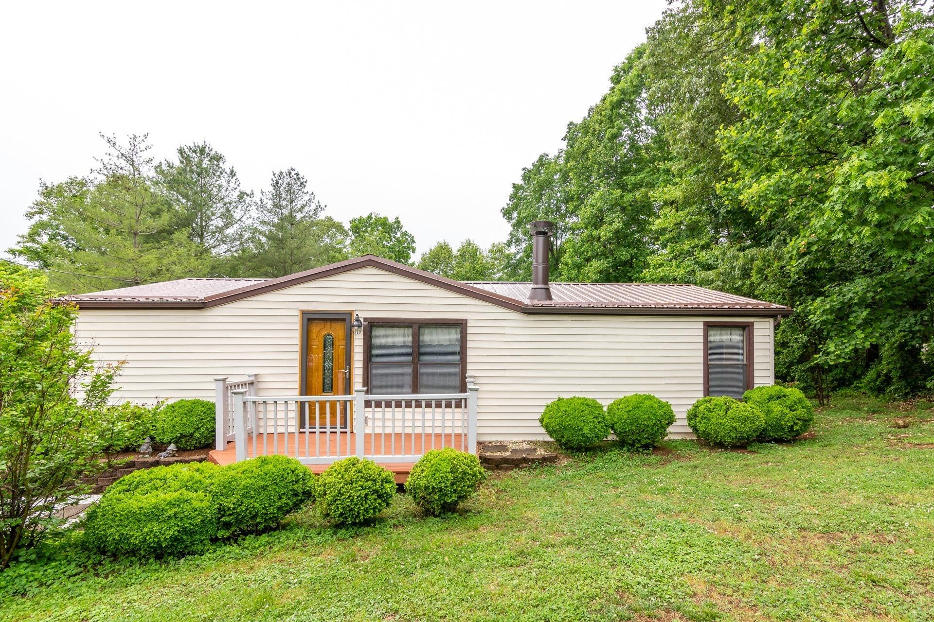 1577 Carroll Road Goodview, VA 24095 - Photo 2 of 40 a view of a house with a yard and plants