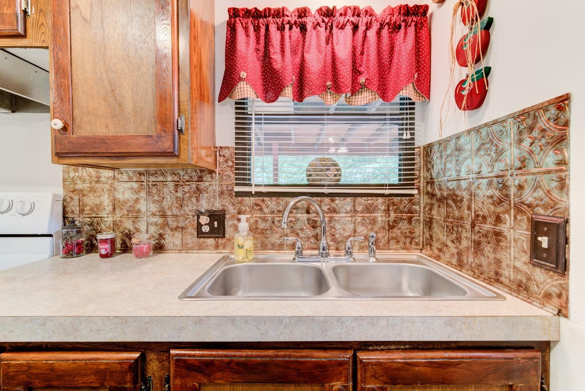 1577 Carroll Road Goodview, VA 24095 - Photo 13 of 40 a bathroom with a sink and a window