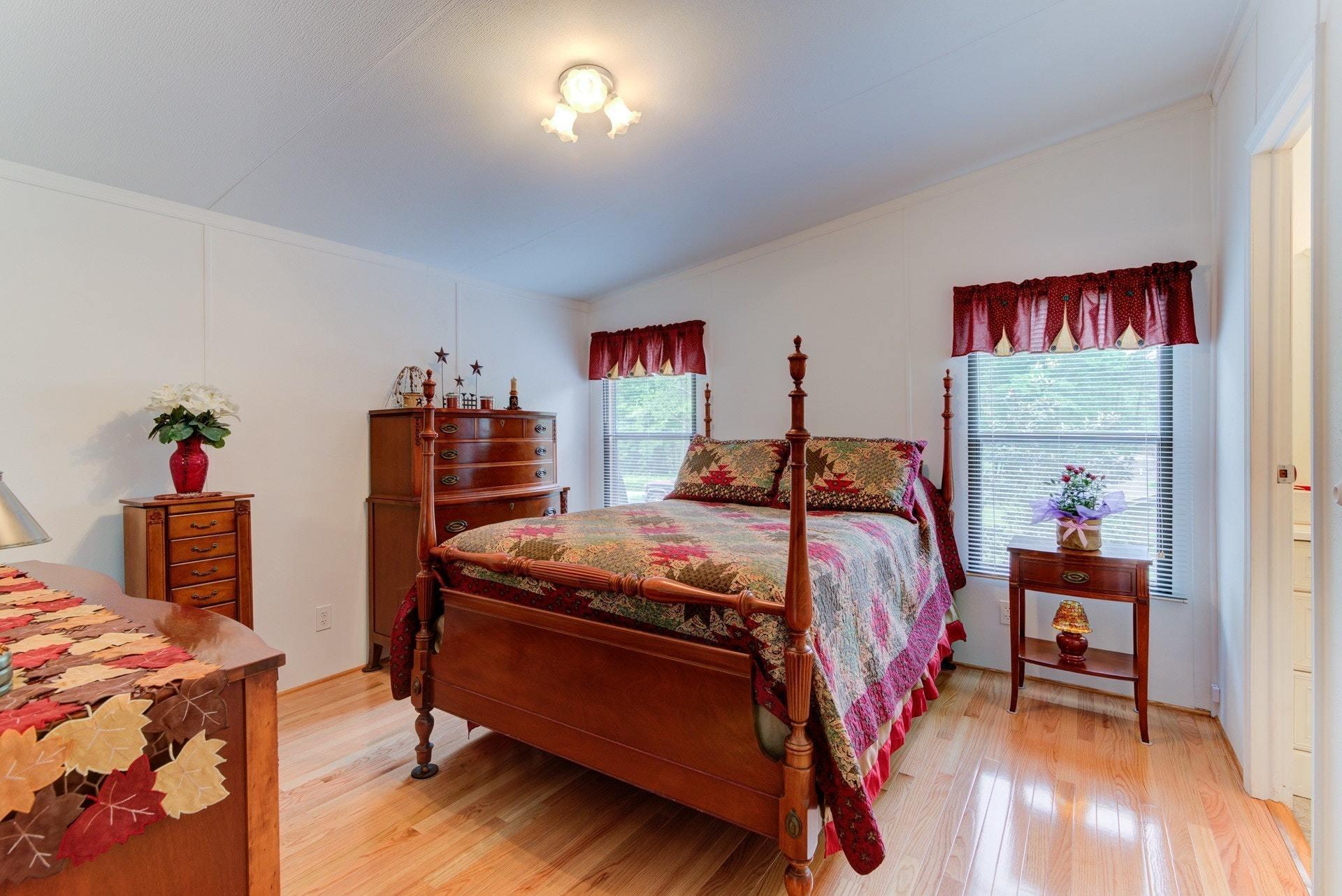 1577 Carroll Road Goodview, VA 24095 - Photo 20 of 40 a bed room with a bed and a chair