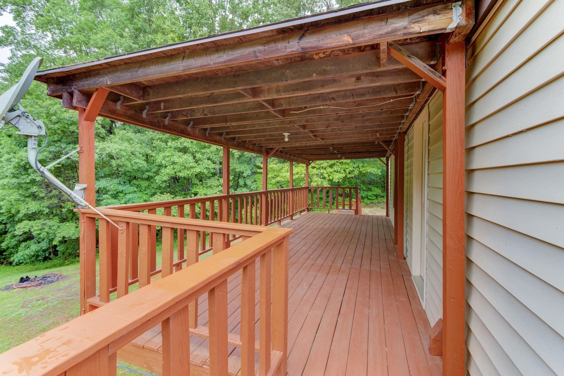 1577 Carroll Road Goodview, VA 24095 - Photo 24 of 40 a view of balcony with deck and wooden floor
