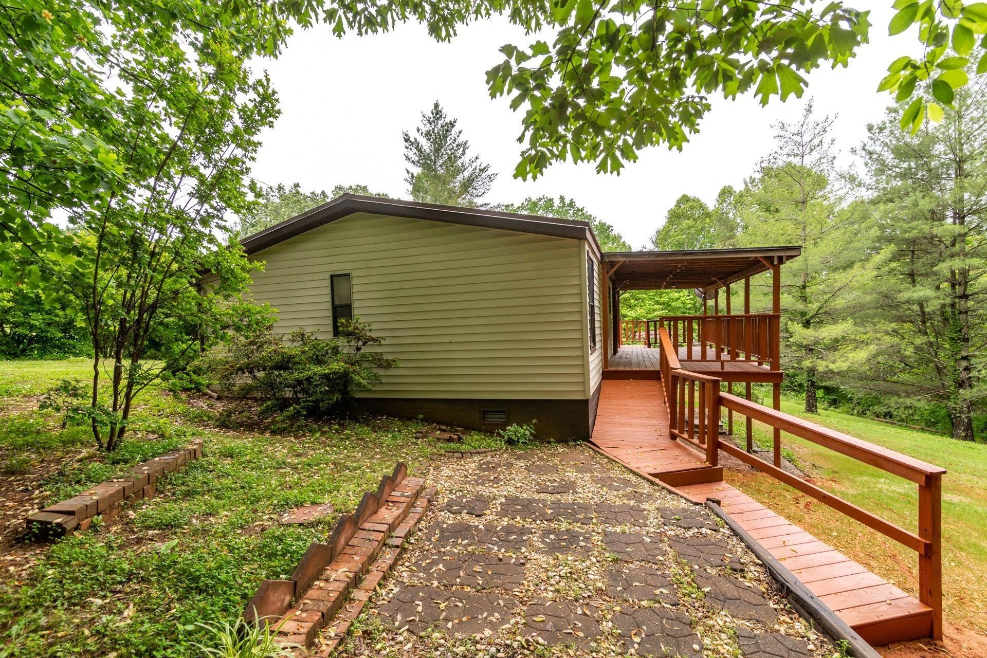 1577 Carroll Road Goodview, VA 24095 - Photo 30 of 40 a backyard of a house with seating space
