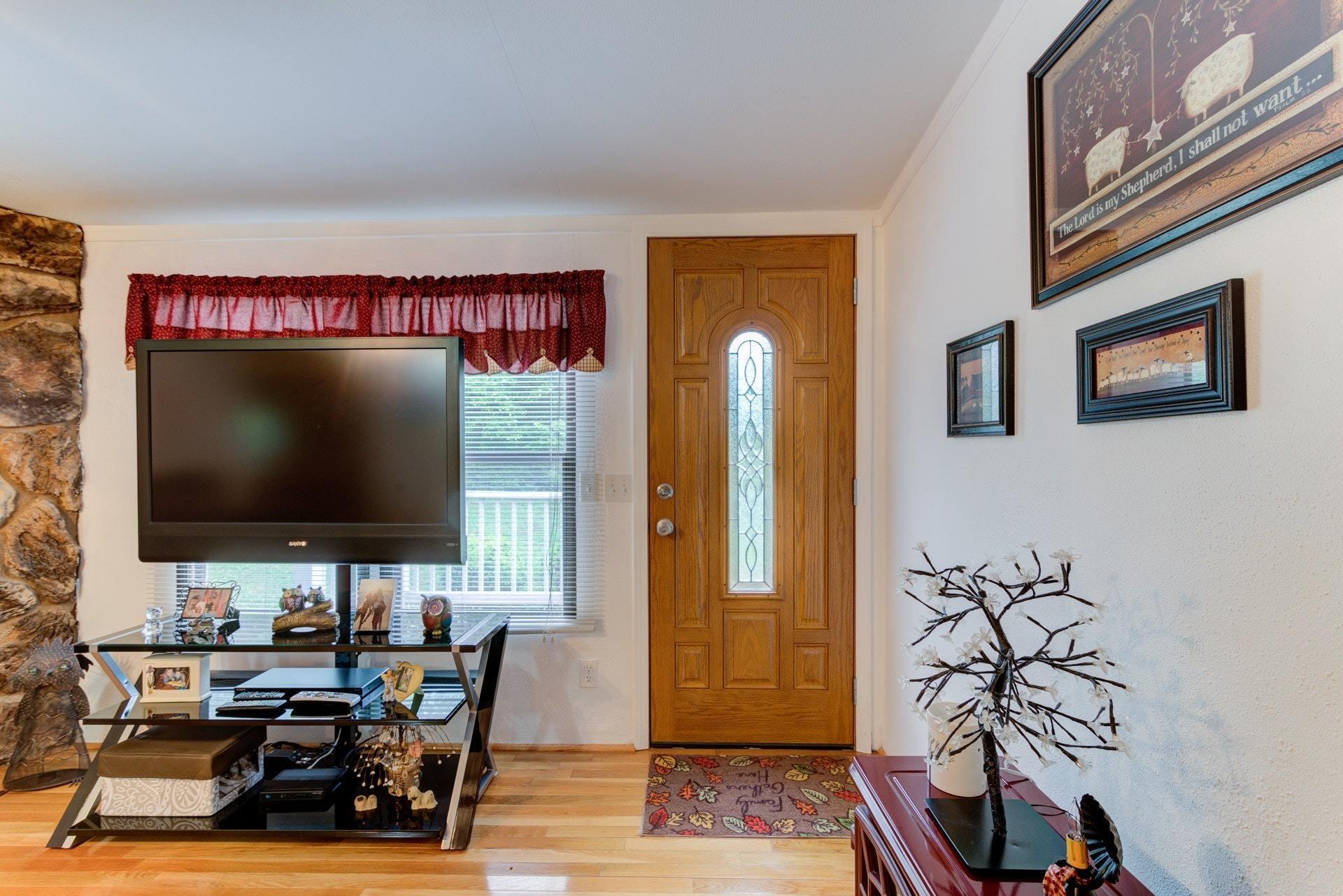 1577 Carroll Road Goodview, VA 24095 - Photo 4 of 40 a living room with furniture and a flat screen tv