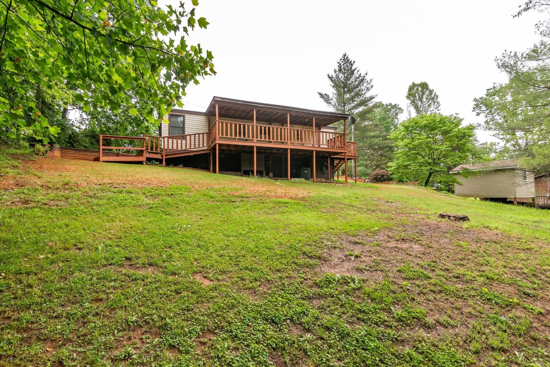1577 Carroll Road Goodview, VA 24095 - Photo 33 of 40 a view of a house with a yard