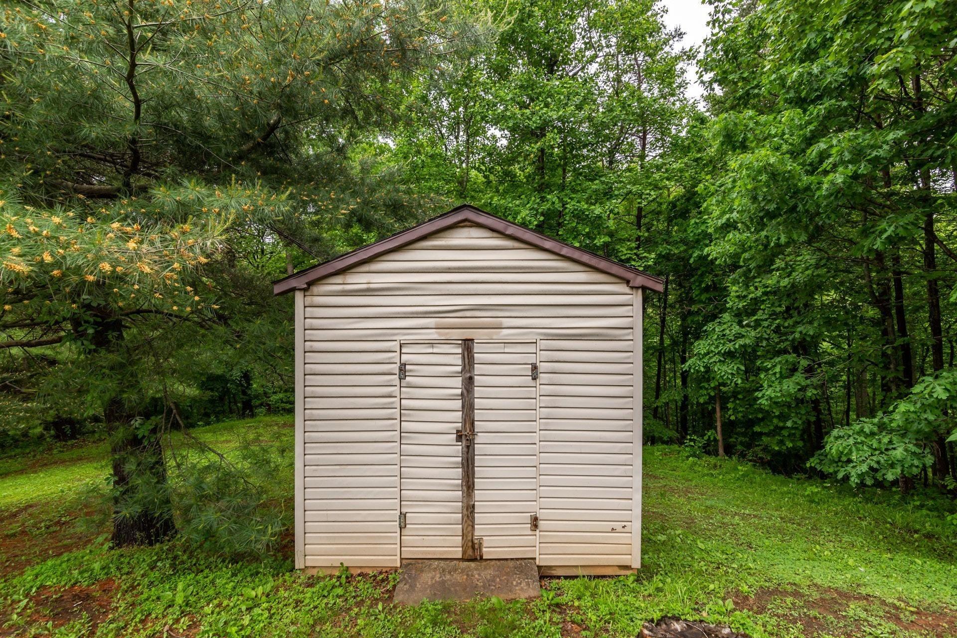 1577 Carroll Road Goodview, VA 24095 - Photo 35 of 40 a view of a house with a yard
