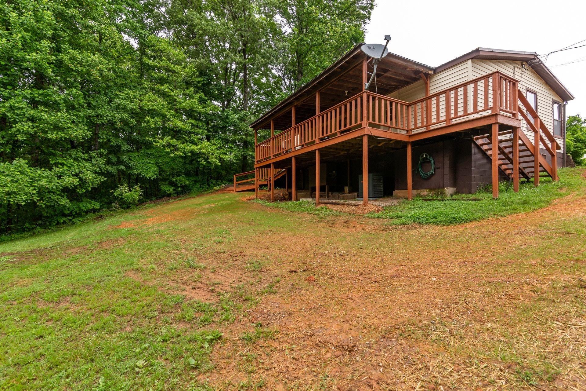 1577 Carroll Road Goodview, VA 24095 - Photo 37 of 40 a front view of a house with garden