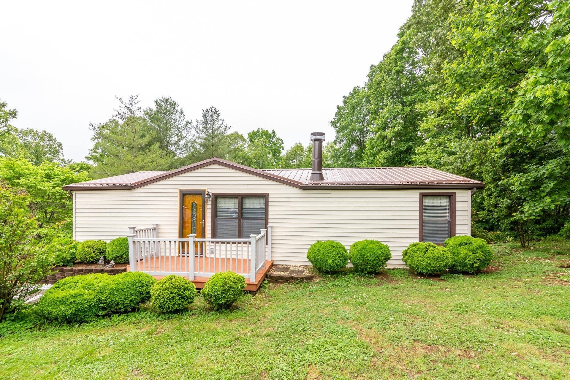 1577 Carroll Road Goodview, VA 24095 - Photo 40 of 40 a view of a house with a yard and plants