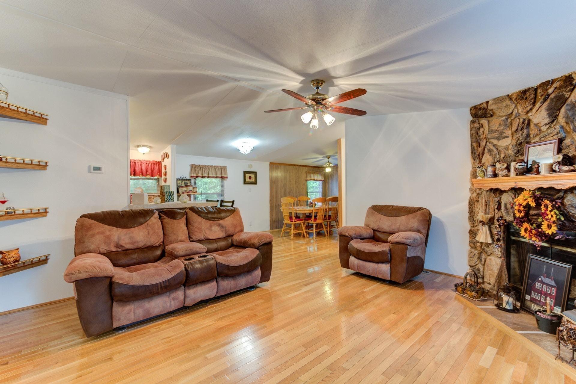 1577 Carroll Road Goodview, VA 24095 - Photo 5 of 40 a living room with furniture a couch and a flat screen tv