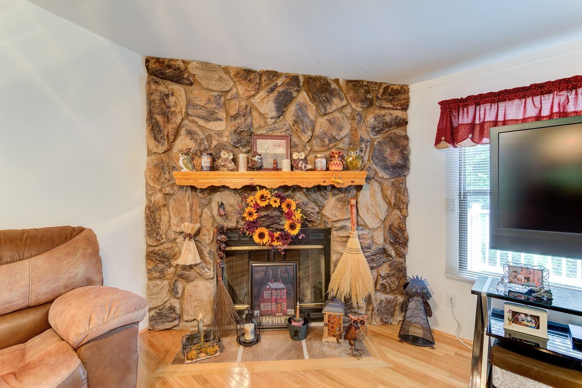 1577 Carroll Road Goodview, VA 24095 - Photo 6 of 40 a living room with furniture and a flat screen tv