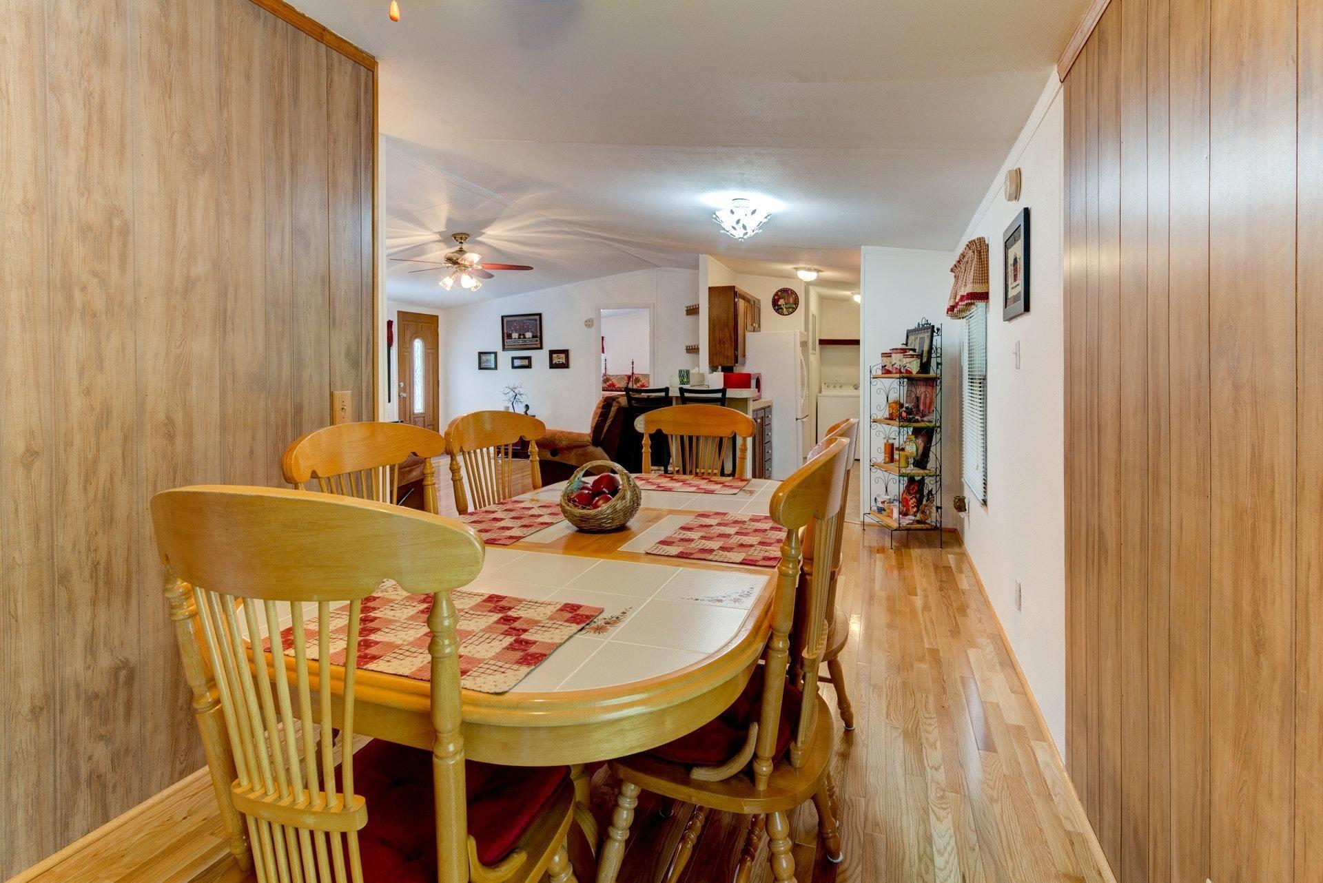 1577 Carroll Road Goodview, VA 24095 - Photo 10 of 40 a view of a dining room with furniture and a chandelier