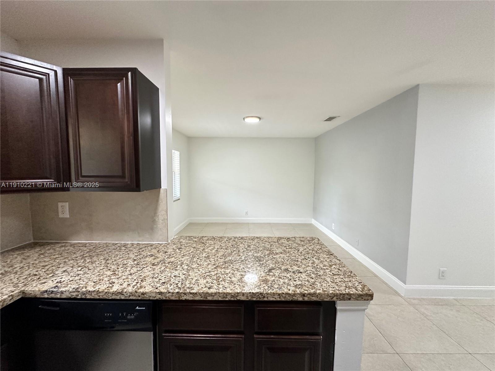 2640 Northeast 8th Avenue, Unit 13 Wilton Manors, FL 33334 - Photo 7 of 34 a view of a kitchen counter space