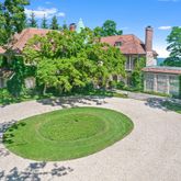 a view of a swimming pool with a yard