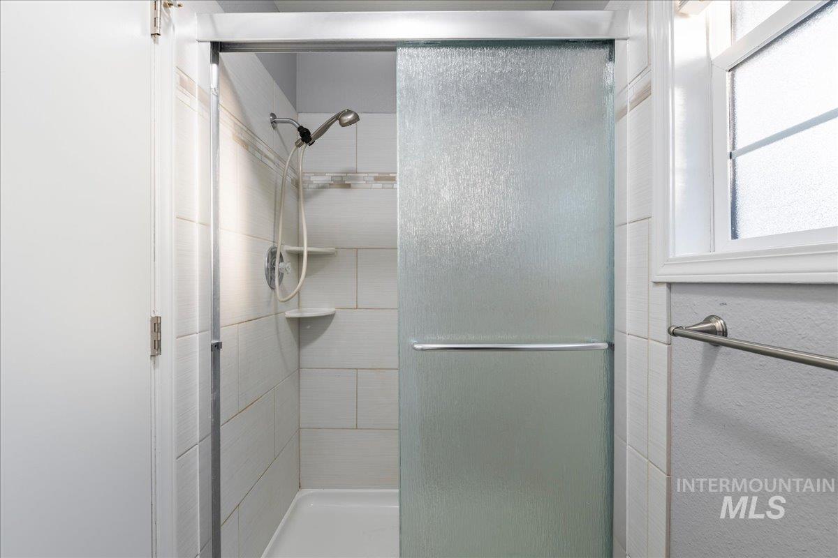 11457 Alejandro Street Boise, ID 83709 - Photo 21 of 42 Bathroom with a stall shower