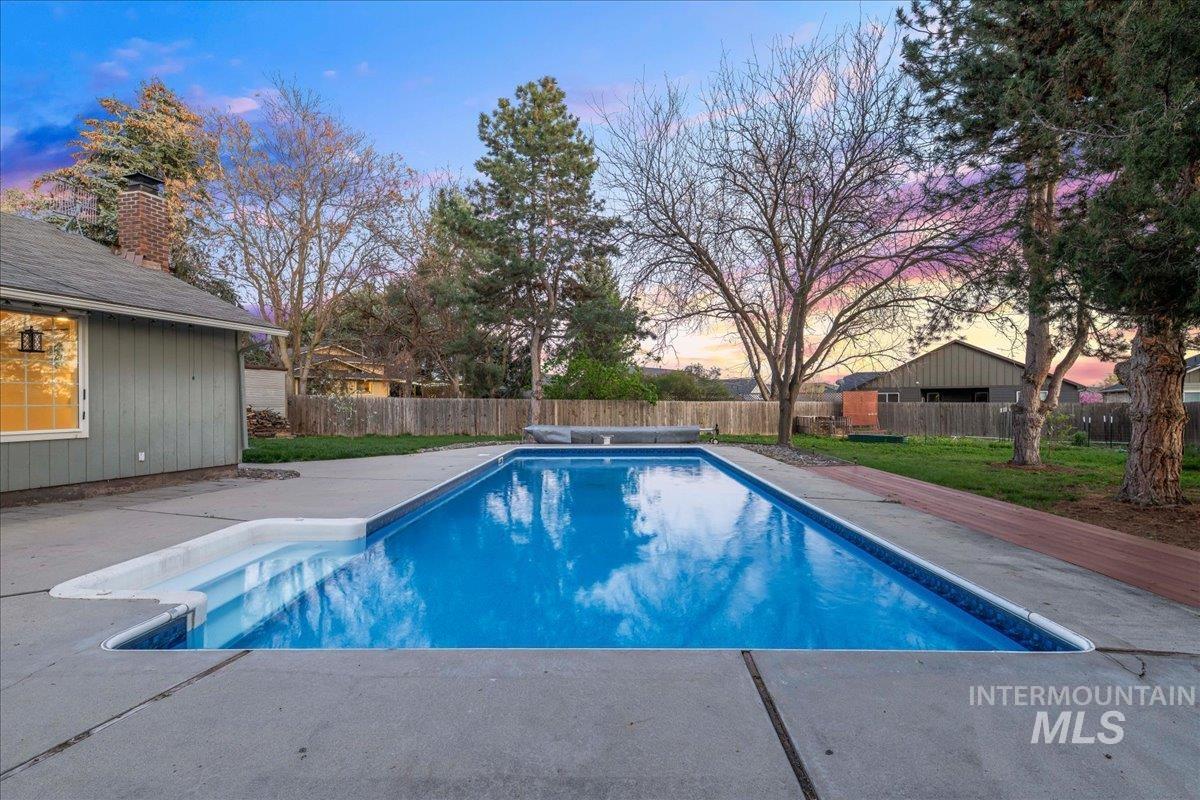 11457 Alejandro Street Boise, ID 83709 - Photo 32 of 42 View of swimming pool featuring a fenced backyard and patio surround