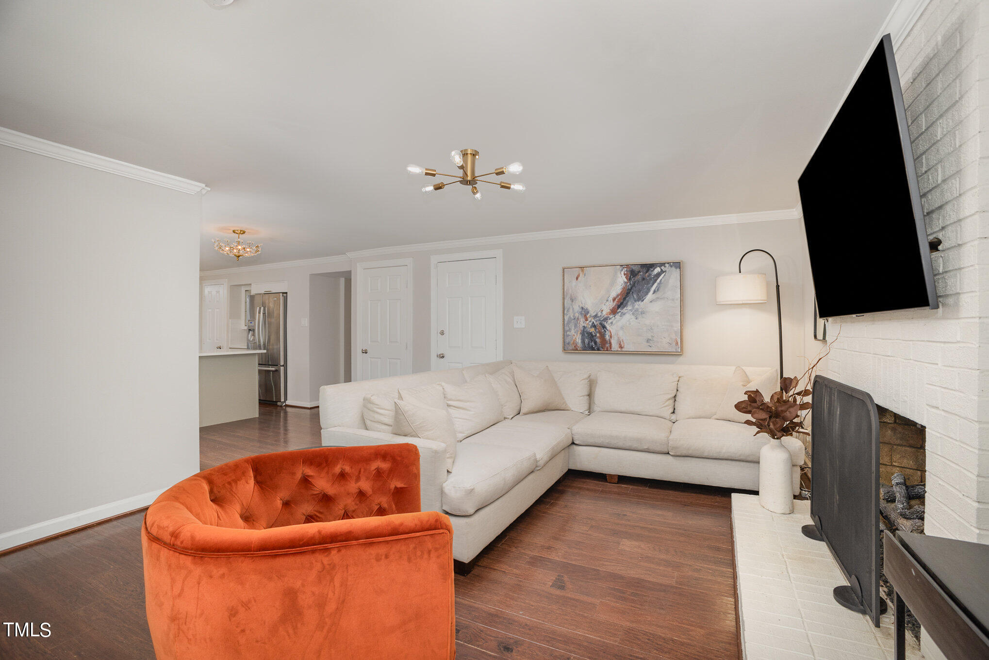 4324 Hickory Ridge Drive Raleigh, NC 27609 - Photo 17 of 34 a living room with furniture fireplace and flat screen tv