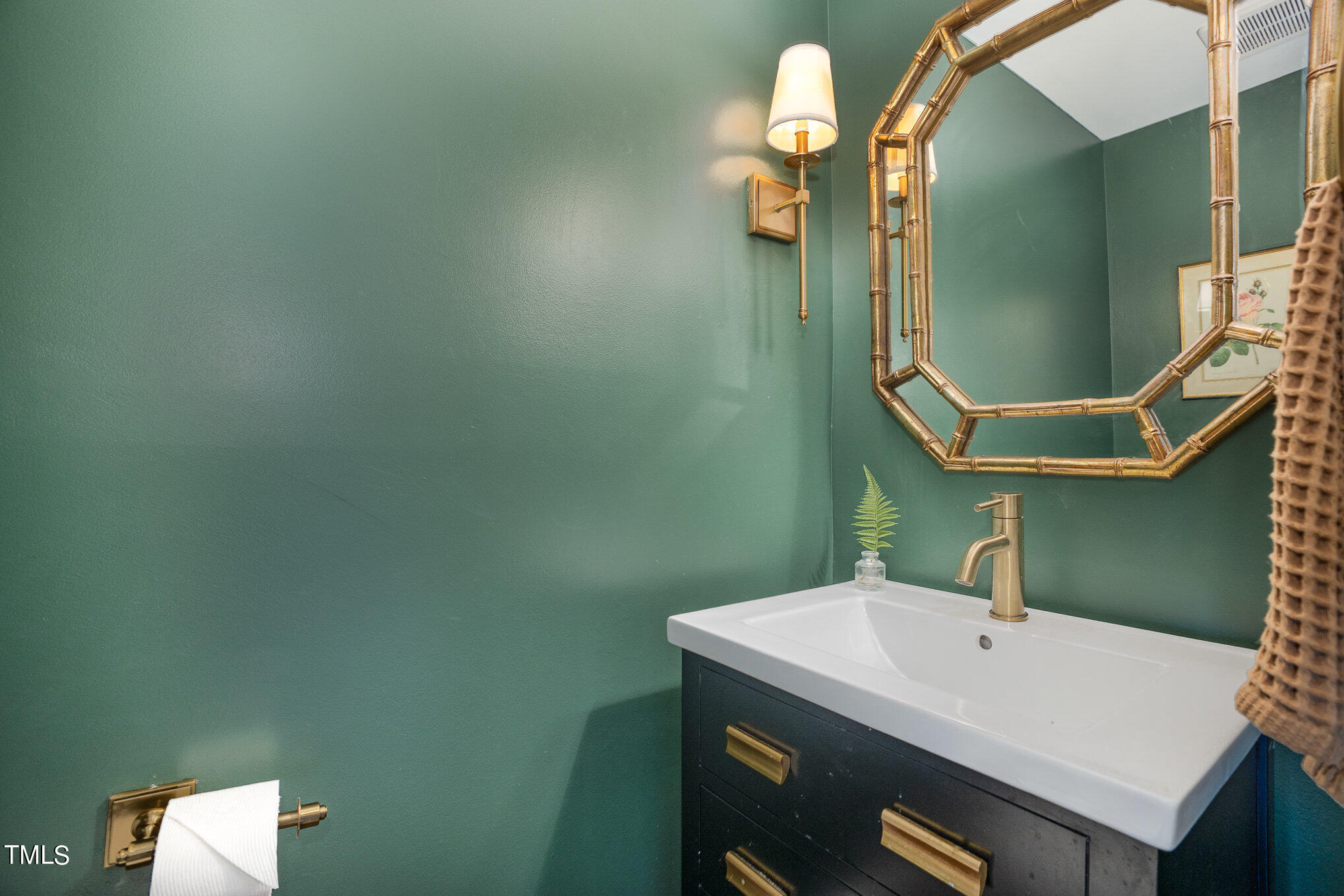 4324 Hickory Ridge Drive Raleigh, NC 27609 - Photo 18 of 34 a bathroom with a sink and mirror