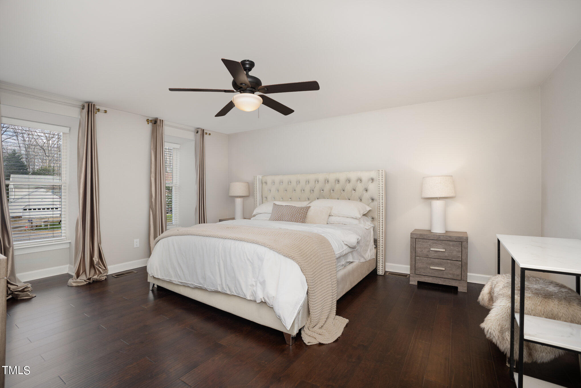 4324 Hickory Ridge Drive Raleigh, NC 27609 - Photo 19 of 34 a bedroom with a bed and a lamp