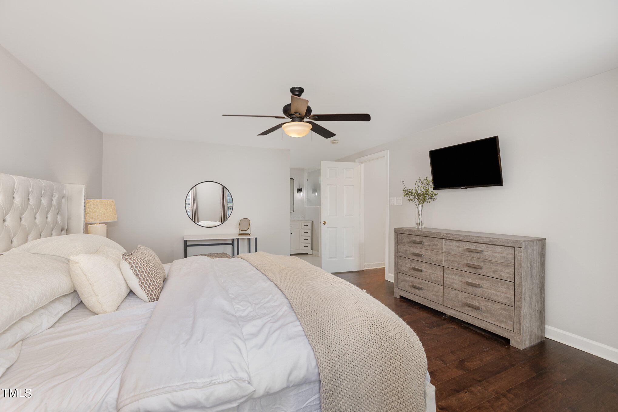 4324 Hickory Ridge Drive Raleigh, NC 27609 - Photo 20 of 34 a bedroom with a bed and a flat screen tv