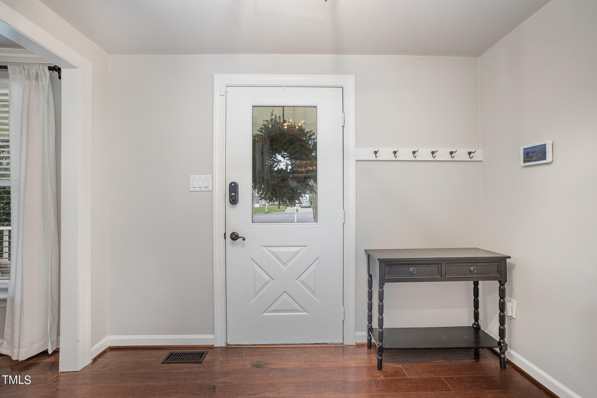 4324 Hickory Ridge Drive Raleigh, NC 27609 - Photo 7 of 34 a view of an empty room with wooden floor and a window