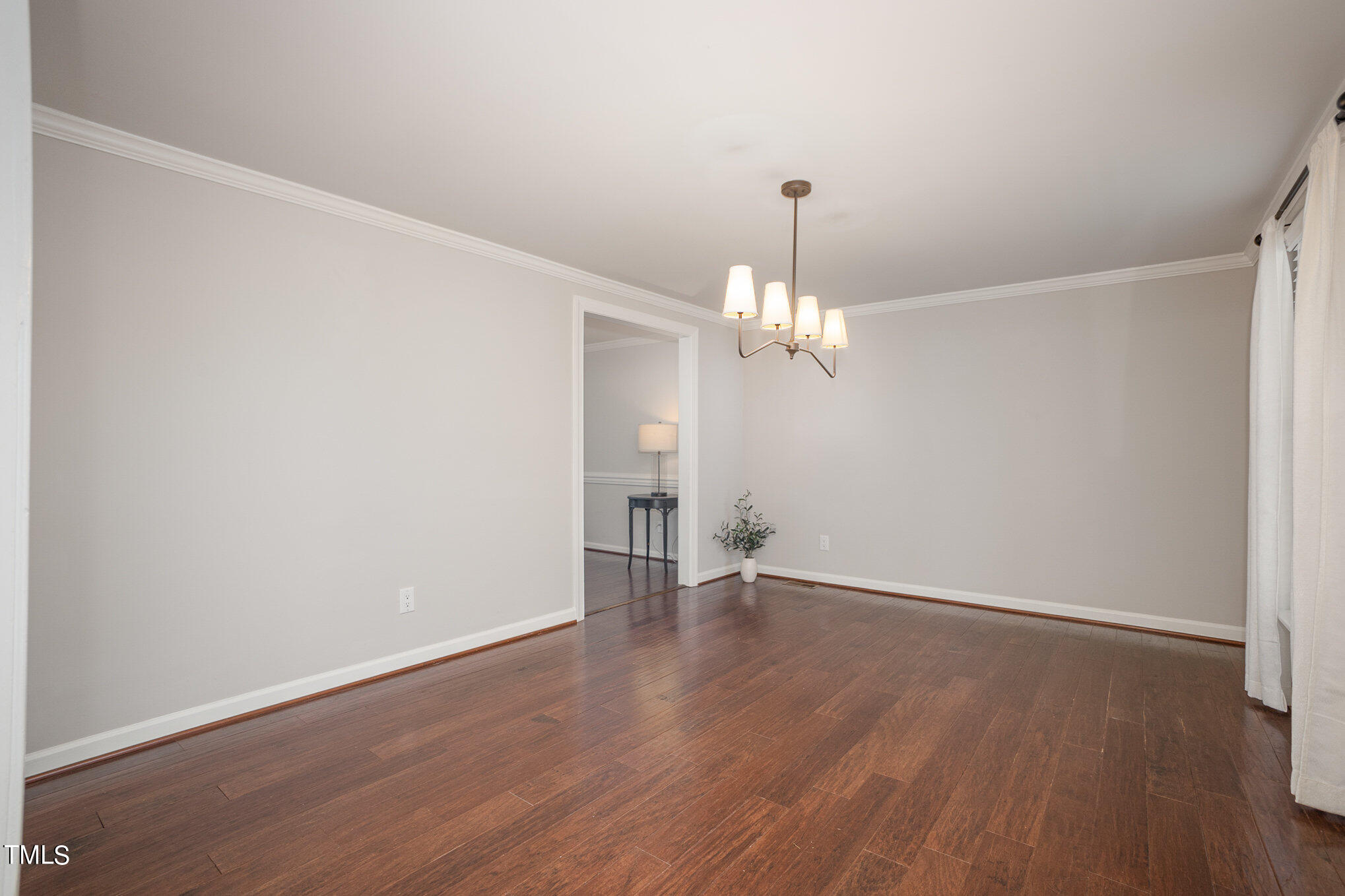 4324 Hickory Ridge Drive Raleigh, NC 27609 - Photo 9 of 34 wooden floor in an empty room with a window