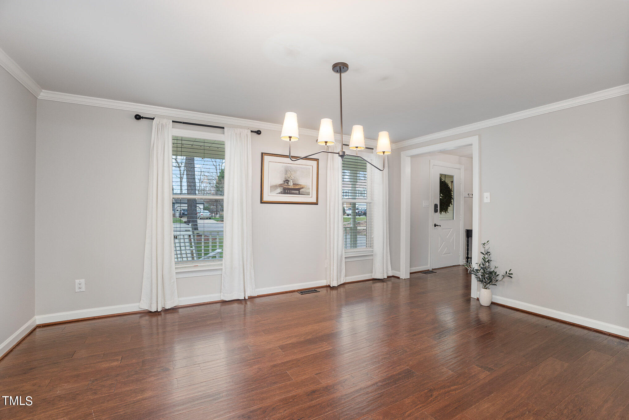 4324 Hickory Ridge Drive Raleigh, NC 27609 - Photo 10 of 34 a view of a room with wooden floor gym equipment and windows
