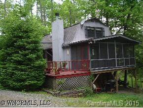 0 Line Runner Ridge Road Rosman, NC 28772 - Photo 2 of 9 a front view of a house with a garden