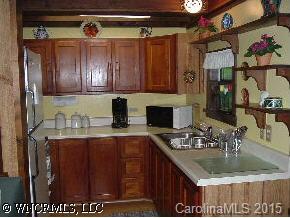 0 Line Runner Ridge Road Rosman, NC 28772 - Photo 3 of 9 a kitchen with a sink a stove and cabinets