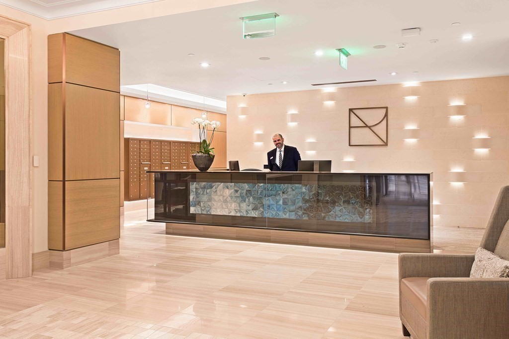 45 Temple Street, Unit PH1 Boston, MA 02114 - Photo 7 of 9 a view of a living room and kitchen with stainless steel appliances