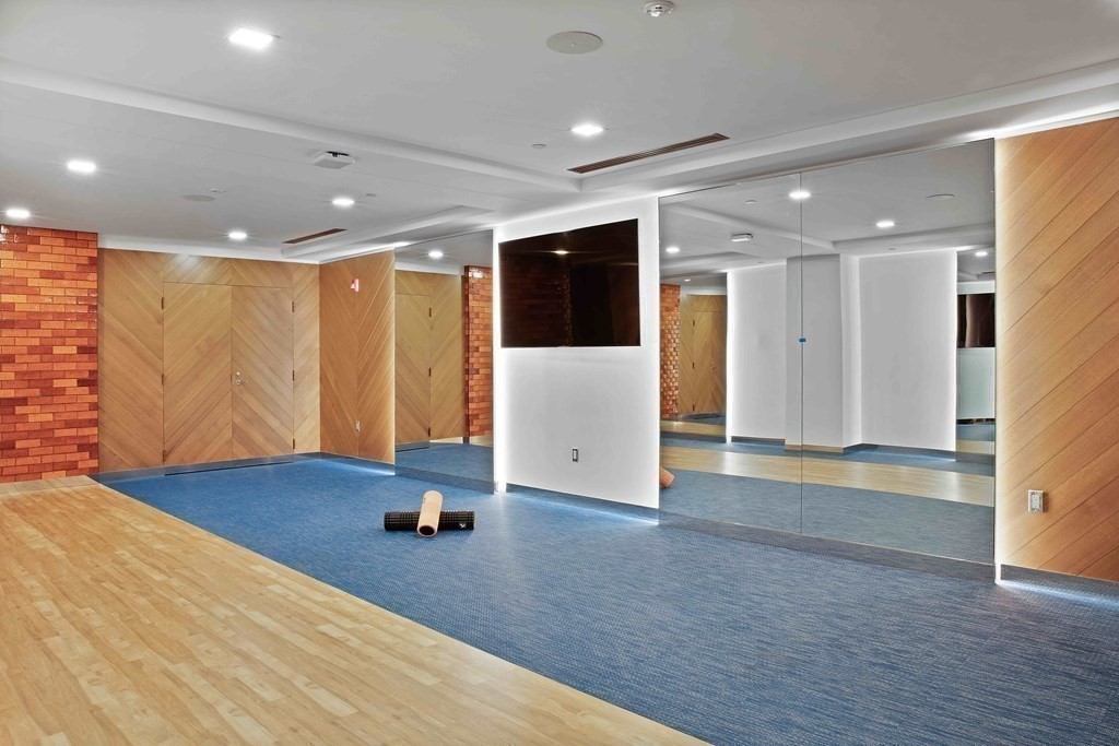 45 Temple Street, Unit PH1 Boston, MA 02114 - Photo 9 of 9 a view of an empty room with wooden floor