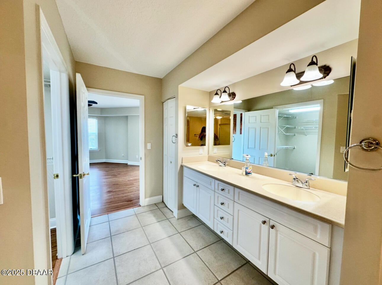 4670 Links Village Drive, Unit C404 Ponce Inlet, FL 32127 - Photo 19 of 41 a spacious bathroom with a granite countertop sink mirror and bathtub