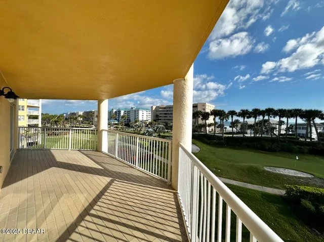 a view of a lake with a house in the background