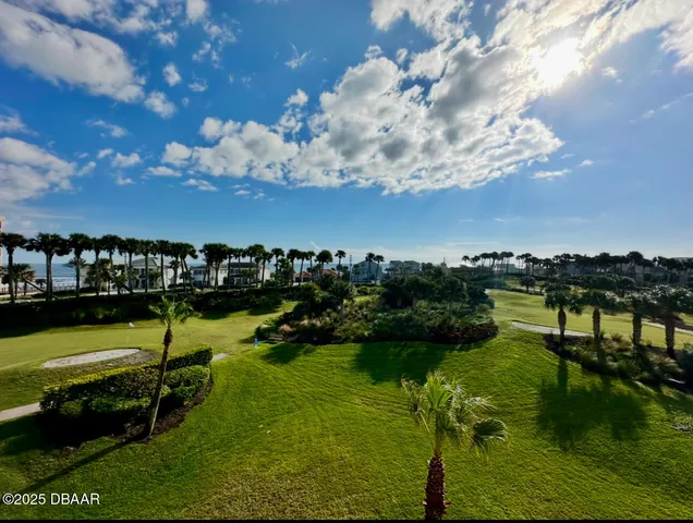 a view of a balcony with wooden floor