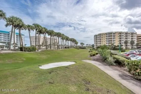 an outdoor space with swimming pool and furniture