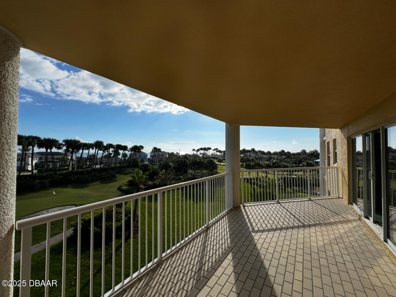 4670 Links Village Drive, Unit C404 Ponce Inlet, FL 32127 - Photo 8 of 41 a balcony with an ocean view