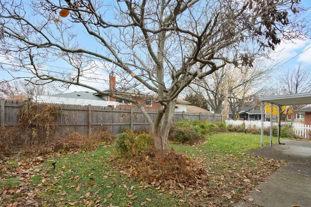 a view of a backyard of the house