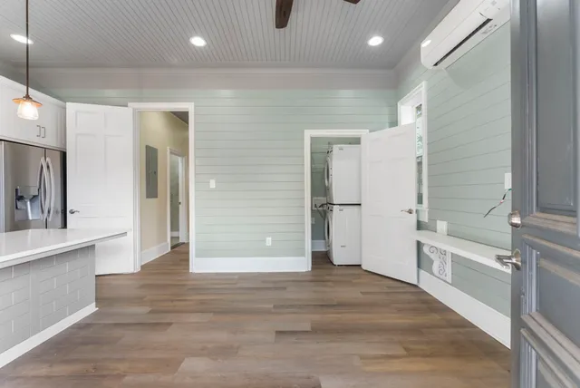 a large kitchen with a lot of counter space and stainless steel appliances