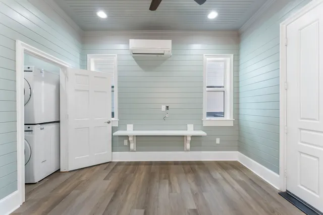 a large kitchen with kitchen island a sink stainless steel appliances and cabinets