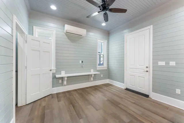 a kitchen with stainless steel appliances a stove a sink and white cabinets