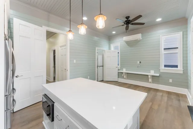 a kitchen with a sink and refrigerator