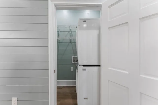 a close view of a utility room with dryer and washer