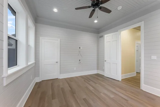 a view of an entryway with wooden floor