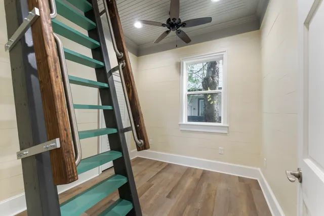 a view of an entryway with wooden floor