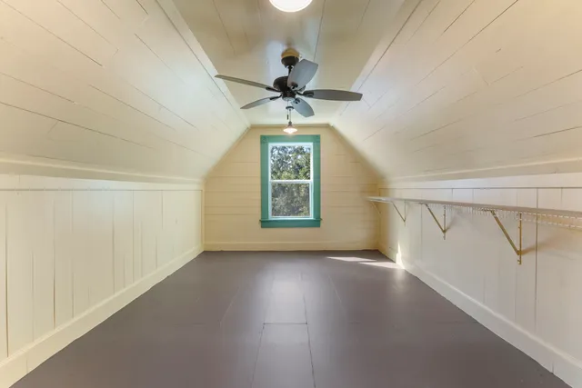 a view of a room with ceiling fan and a ceiling fan