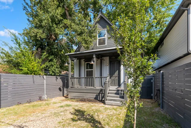 a view of a porch with wooden floor and stairs