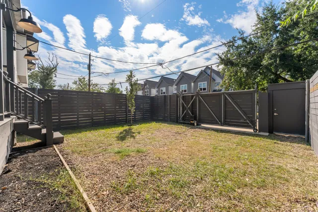 a bathroom with a tub shower and sink